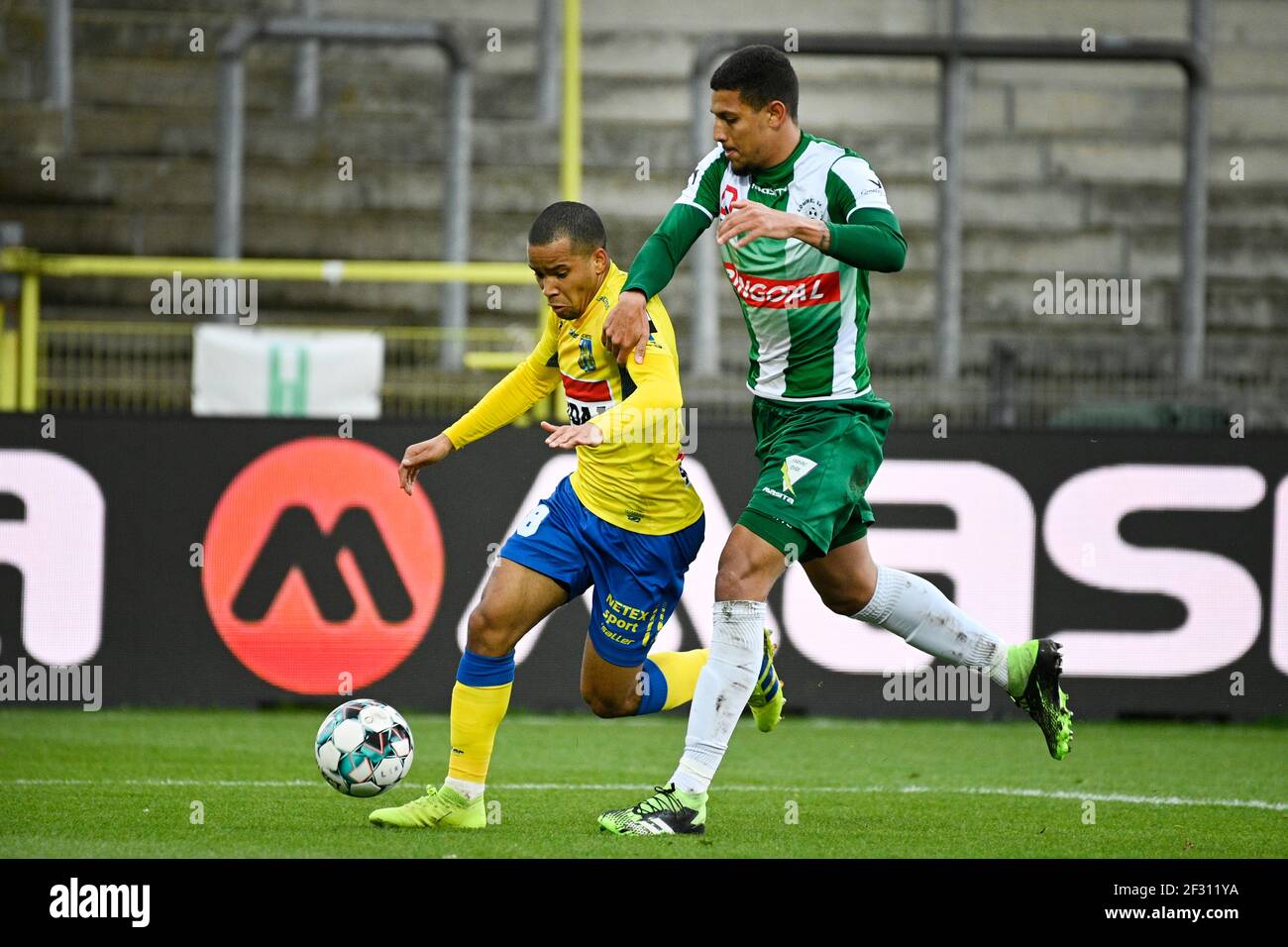 Westerlo's Kurt Abrabams and Lommel's Vinicius De Souza Costa fight for