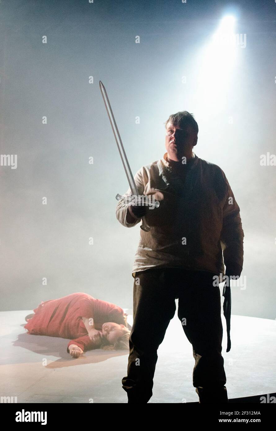 Mati Turi (Siegfried) with sleeping Brunnhilde in GOTTERDAMMERUNG by Wagner at Longborough Festival Opera, Gloucestershire, England  17/07/2012 conductor: Anthony Negus  design: Kjell Torriset  lighting: Ben Ormerod  director: Alan Privett Stock Photo