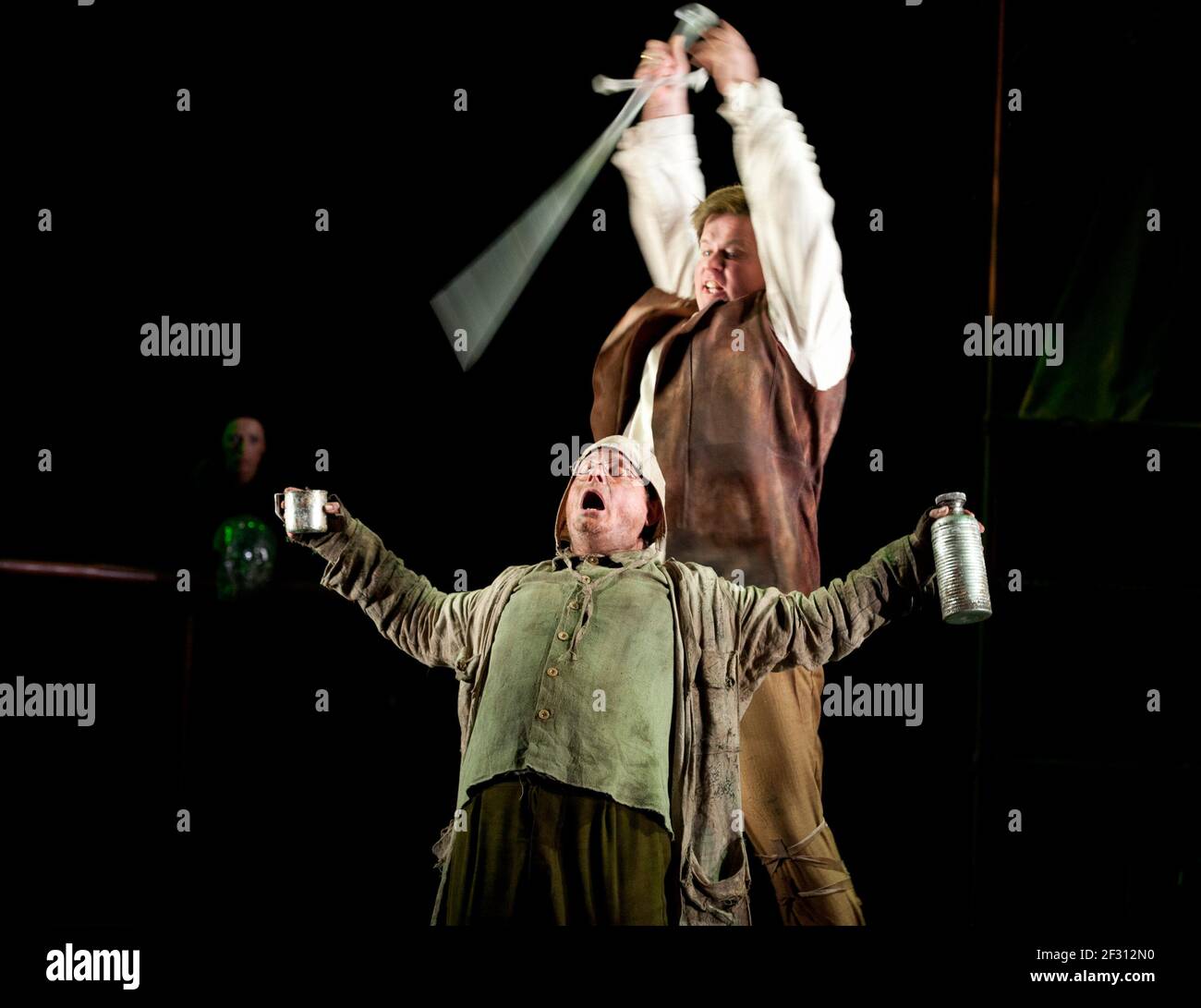 Siegfried (Daniel Brenna) kills Mime (Colin Judson) with Nothung (magic sword) in SIEGFRIED by Wagner at Longborough Festival Opera, Gloucestershire, England 23/07/2011 conductor: Anthony Negus design: Kjell Torriset lighting: Guy Hoare director: Alan Privett Stock Photo