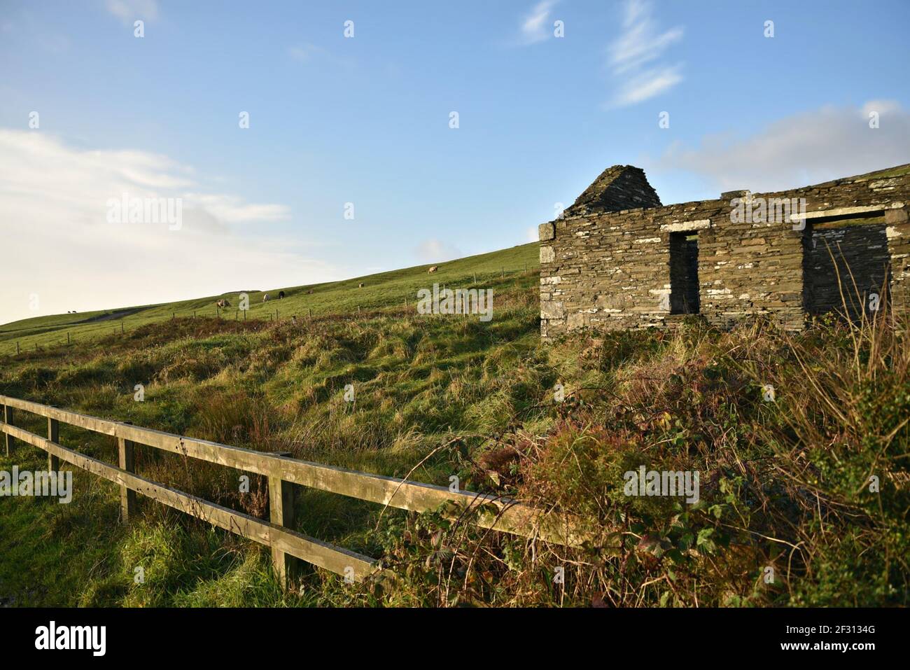 Irish landscape with an abandoned stone house in the countryside of