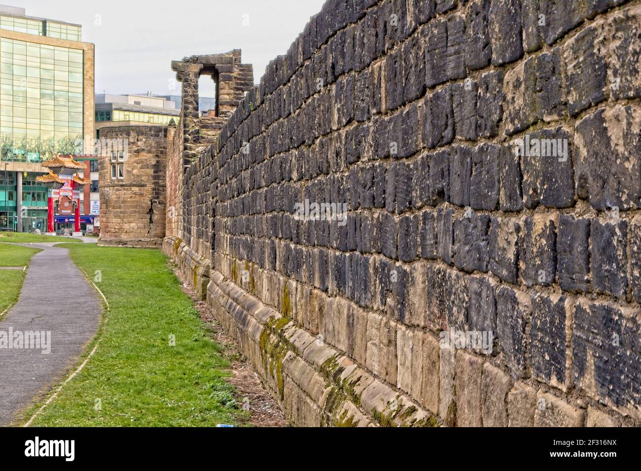 The Newcastle town wall is a medieval defensive wall, and Scheduled Ancient Monument, in Newcastle upon Tyne, England. It was built during the 13th an Stock Photo