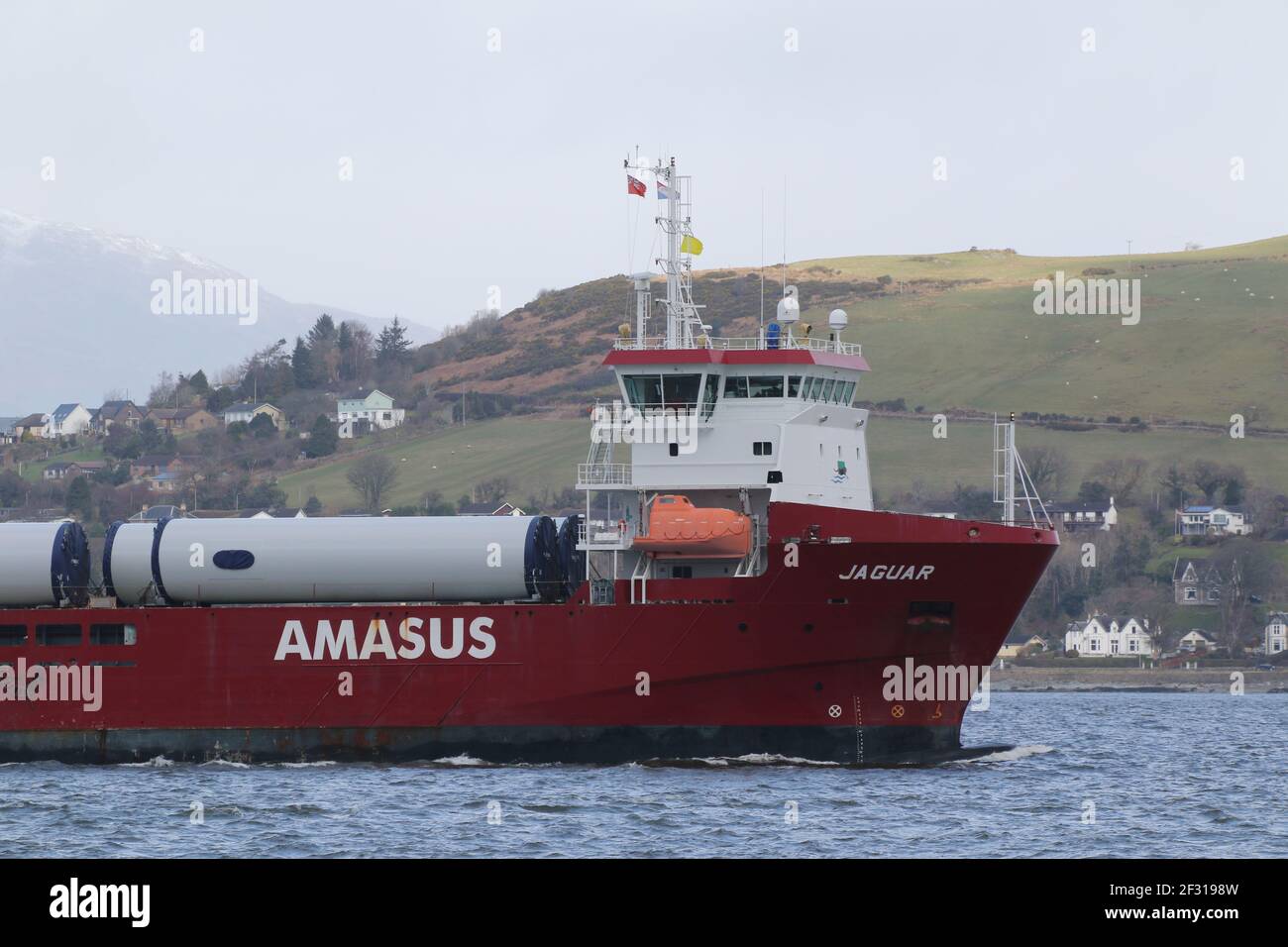 Jaguar, a general cargo vessel operated by Amasus Shipping, with a cargo of wind turbine parts, passing Kempock Point, Gourock, on the Firth of Clyde Stock Photo