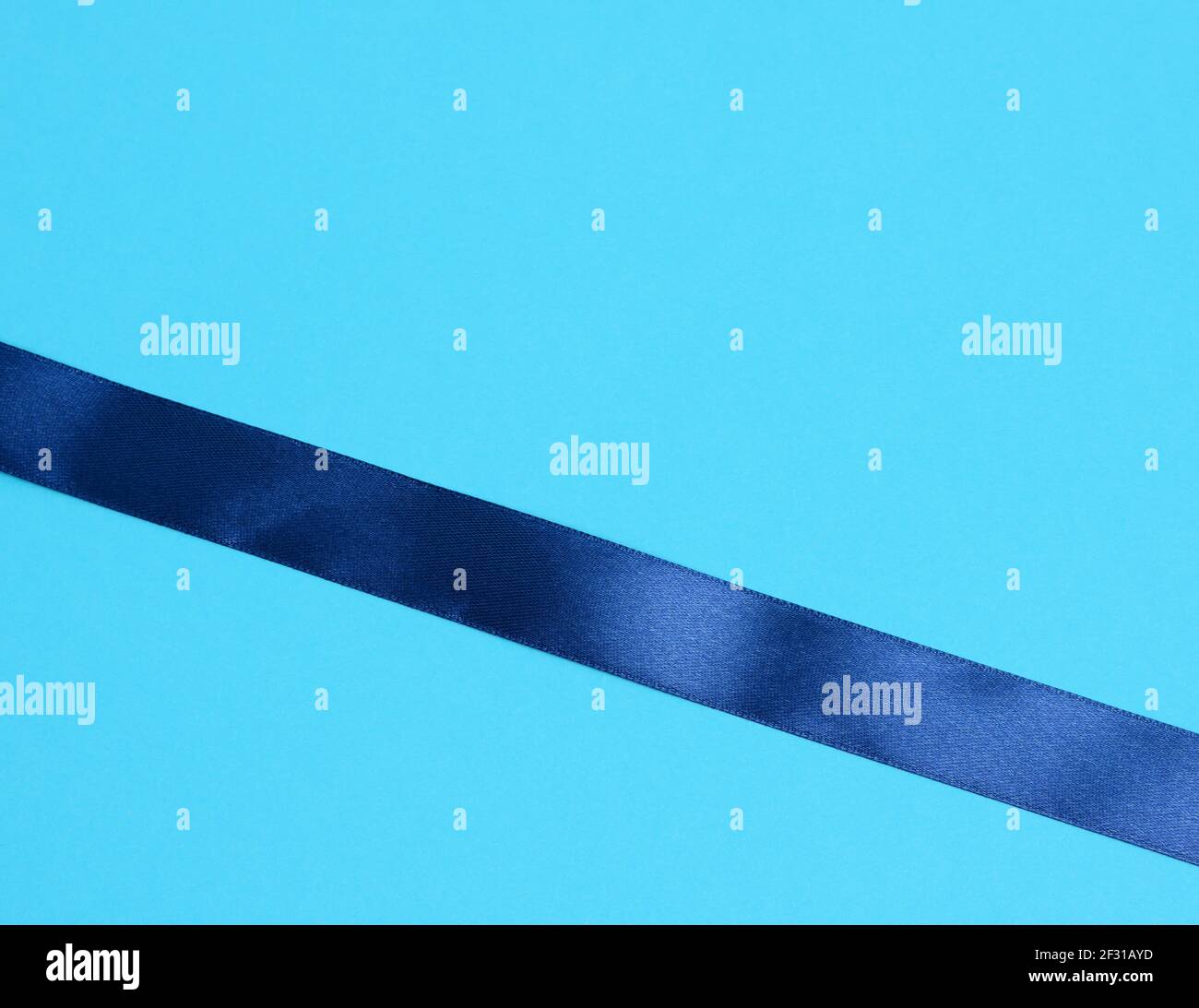 Blue silk ribbon on a blue background, festive backdrop Stock Photo - Alamy