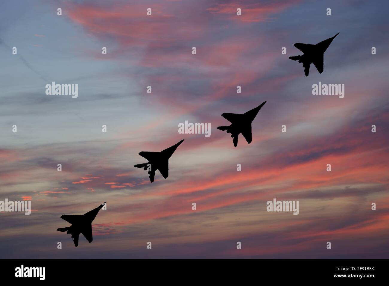 Flight of modern combat fighters on the sky background Stock Photo - Alamy