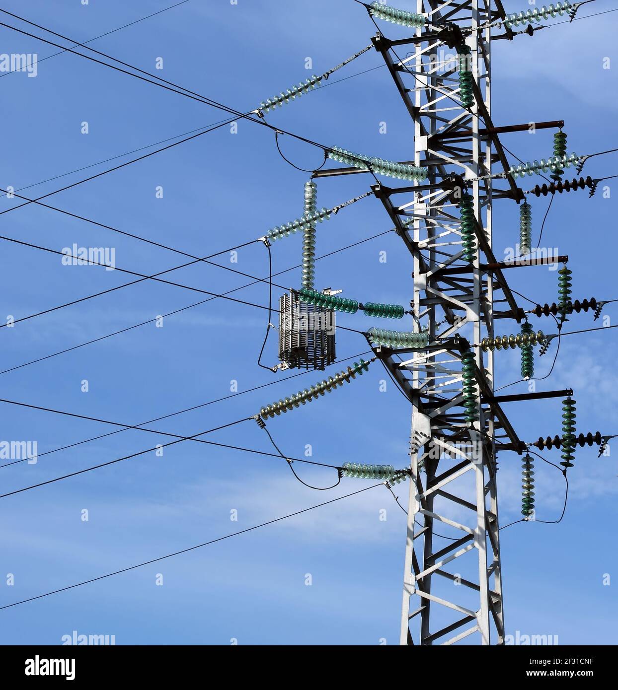 electric pylon and building crane at the background of building under ...