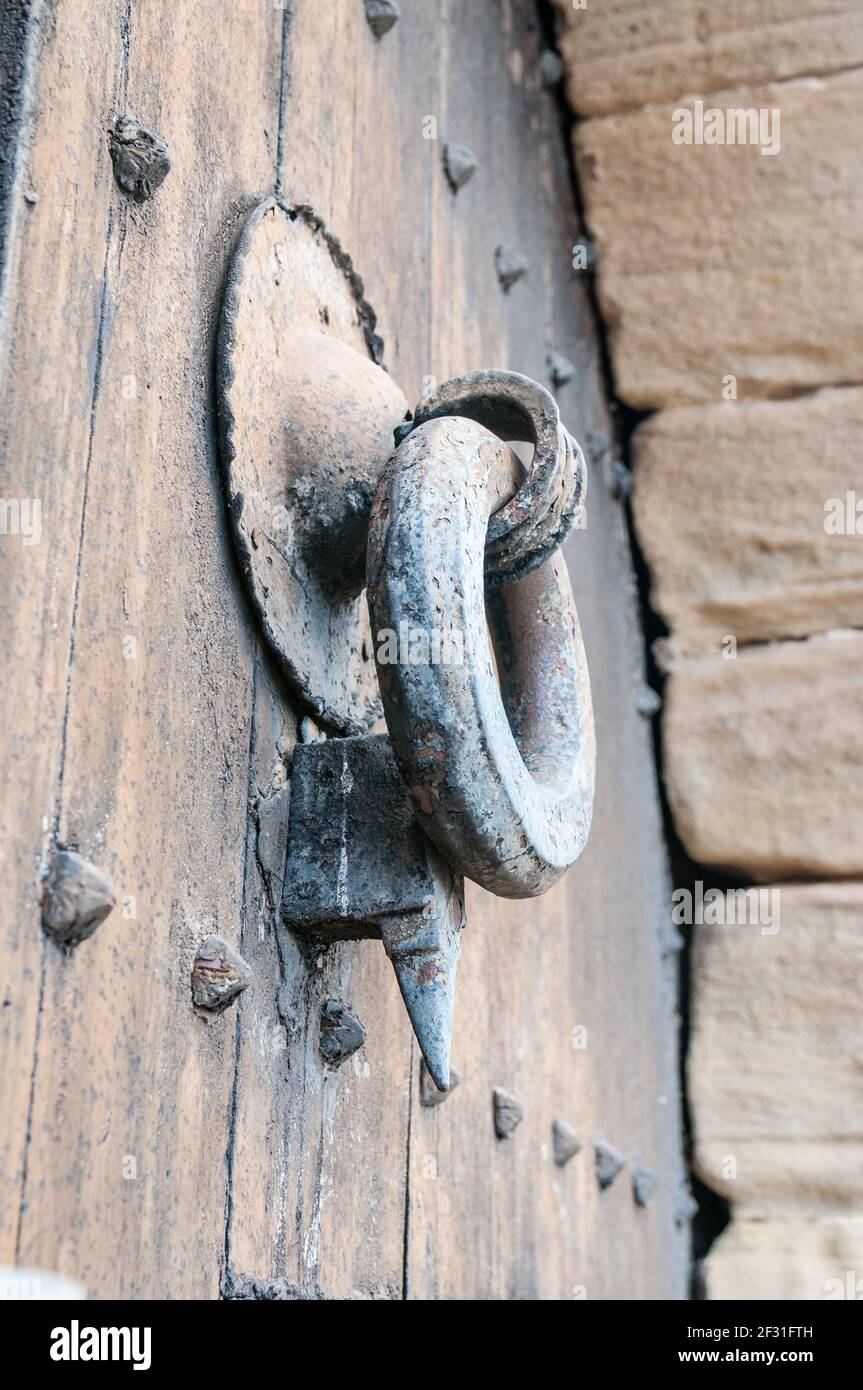 old door knob on a wooden door, Talamanca, Catalonia, Spain Stock Photo