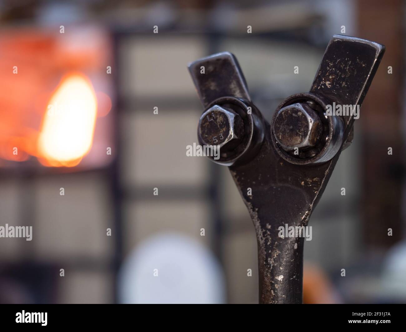 Shining glass blowing furnace at work. Gas kiln in glass design studio