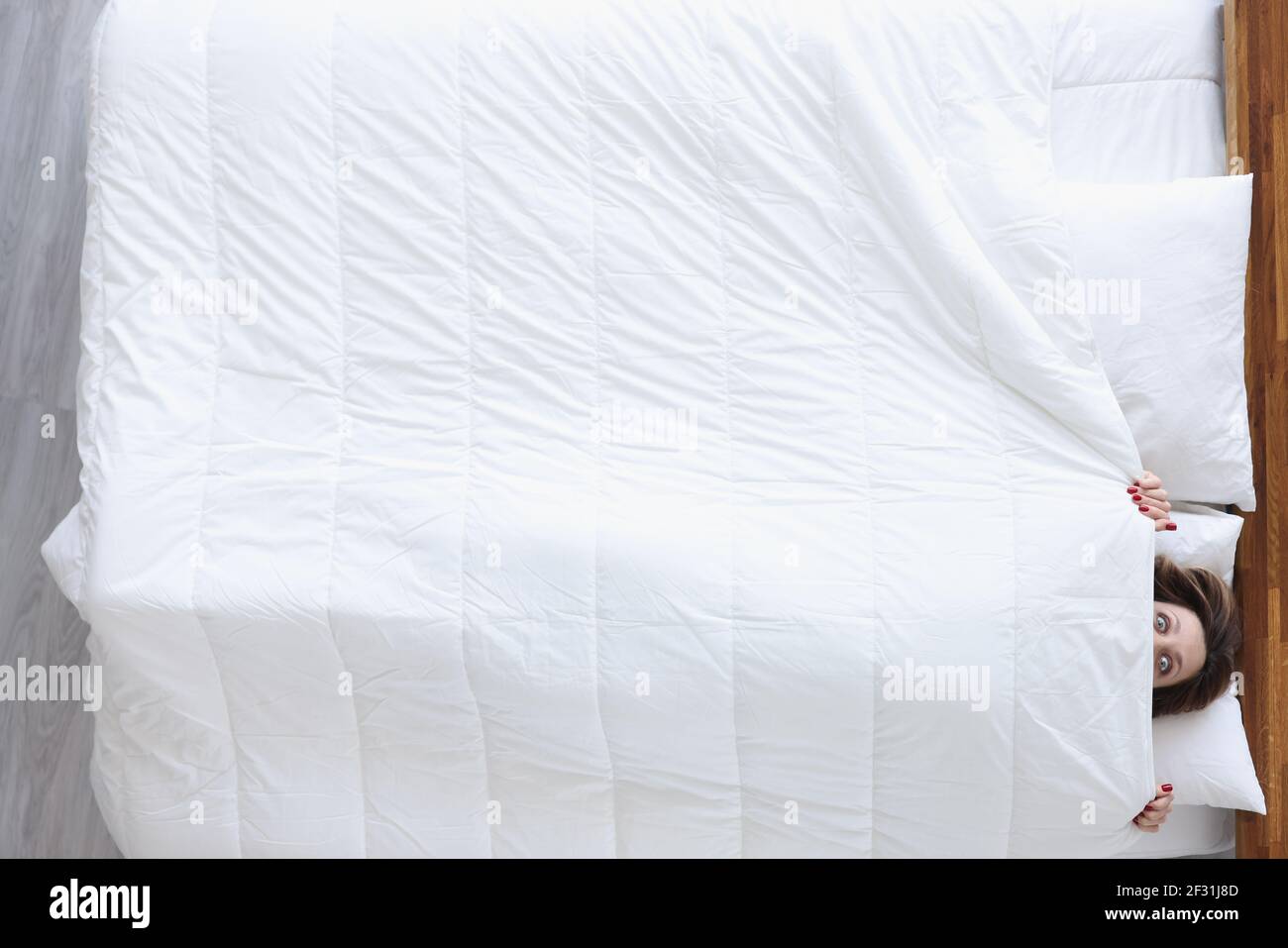 Hiding under covers scared hires stock photography and images Alamy