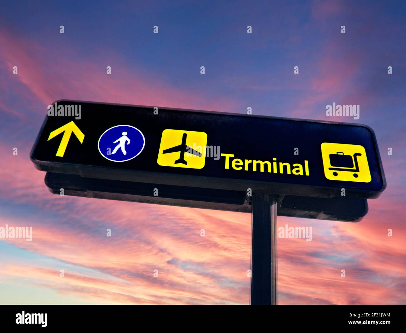 Airport sign signs signage concept travel sunrise on Airline passenger terminal direction information panel. Concept Concepts new dawn start of passenger air travel signage for departing vacation holiday airline passengers, directing to terminals, airlines, baggage drop, walkway check-in Stock Photo