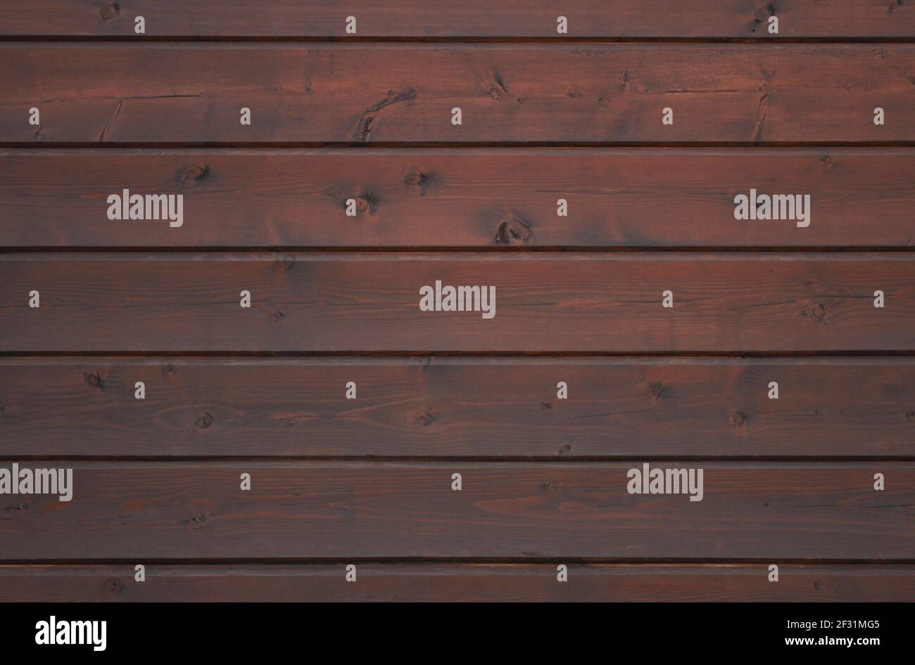 Wooden wall lined with dark plank as background Stock Photo