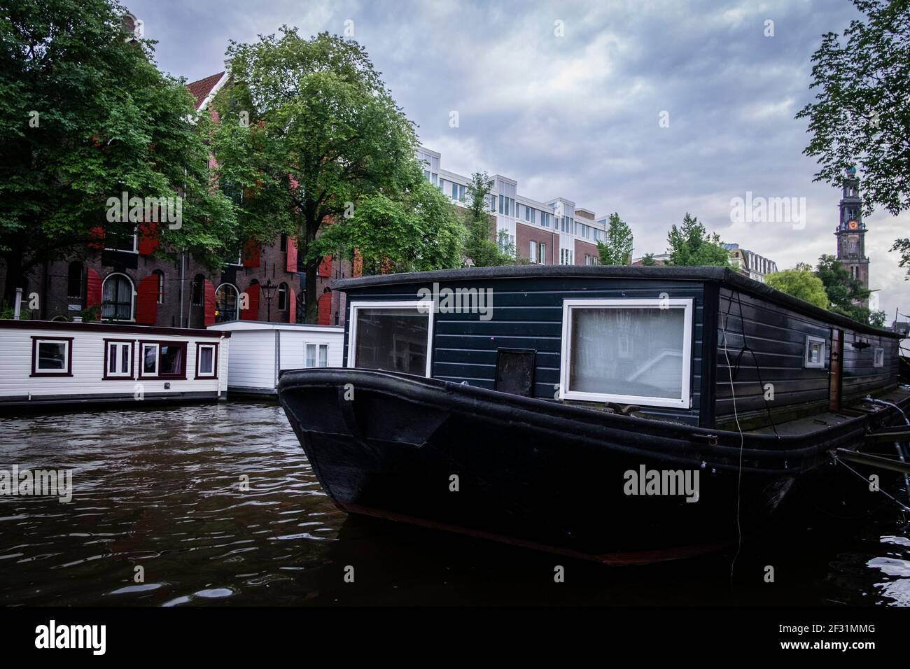 Amsterdam Canals are famous for their houseboats Stock Photo