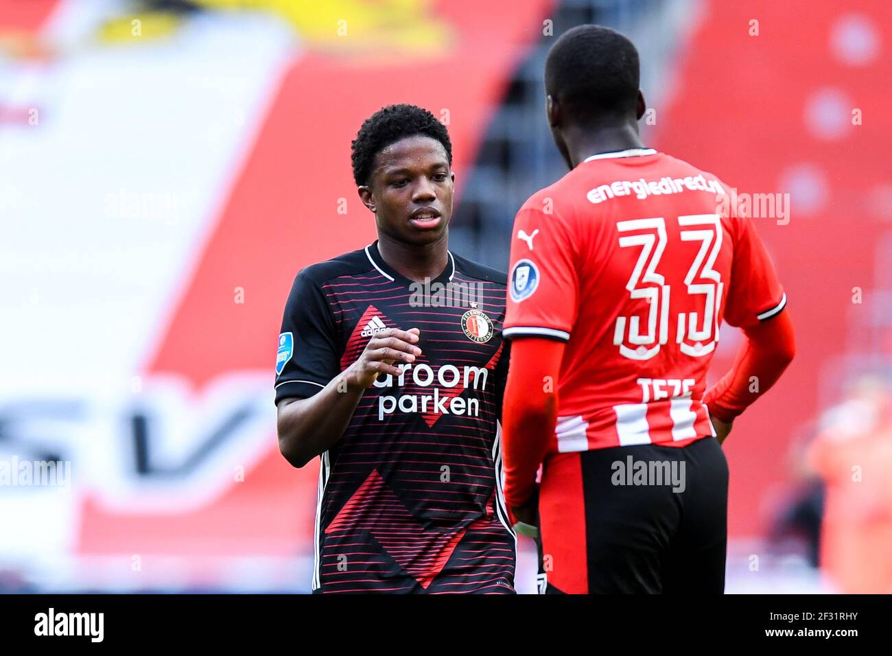 EINDHOVEN, NETHERLANDS - MARCH 14: Tyrell Malacia of Feyenoord Rotterdam,  Jordan Teze of PSV during the Dutch Eredivisie match between PSV Eindhoven  a Stock Photo - Alamy