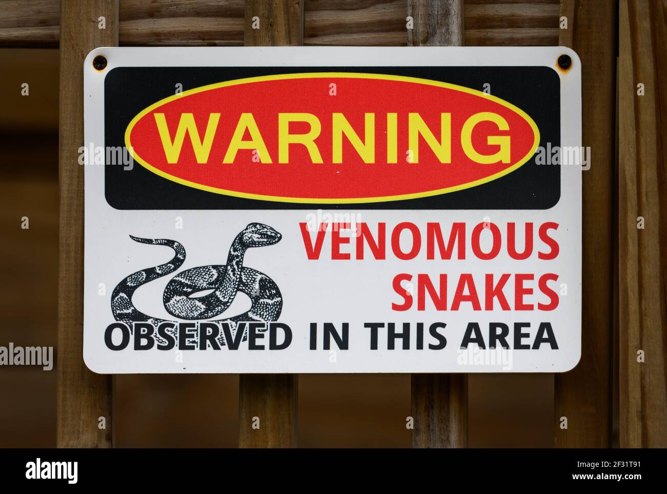 Warning sign for venomous snakes. Houston, Texas, USA. Stock Photo