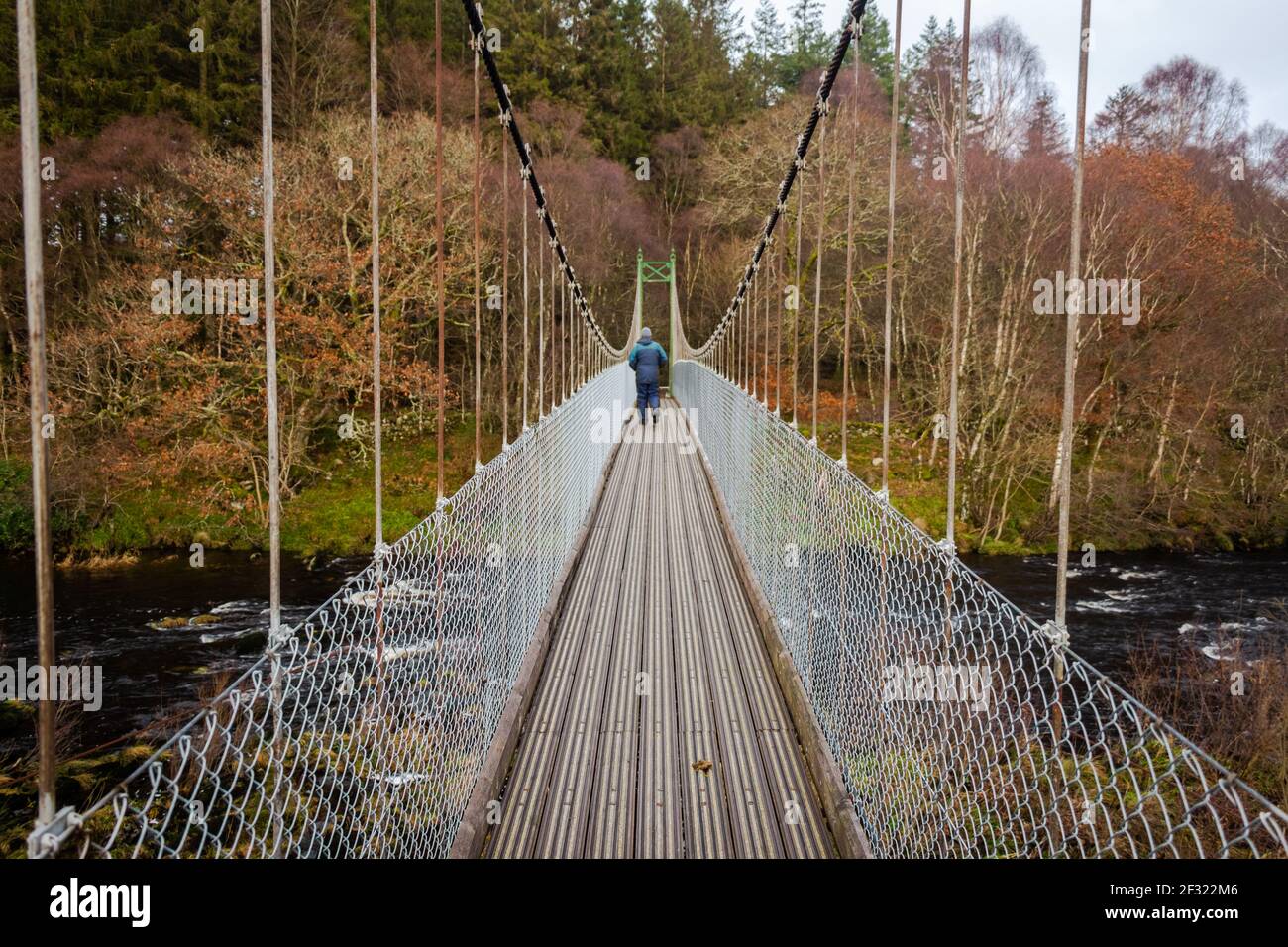 Man walking suspension bridge hi-res stock photography and images - Alamy