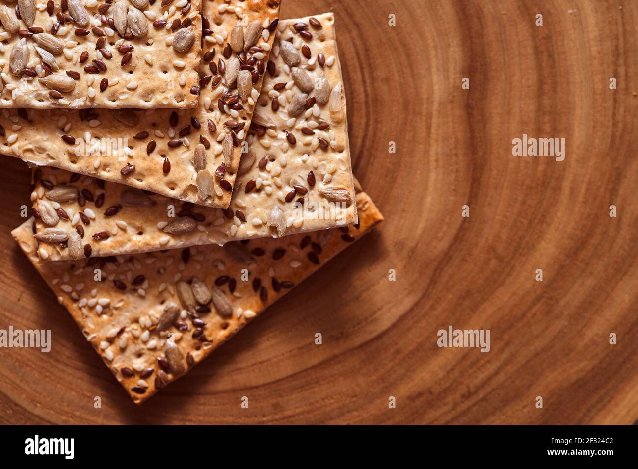 Flour breadcrumbs biscuits with sunflower flax seeds on awooden background. Top view. High quality photo Stock Photo