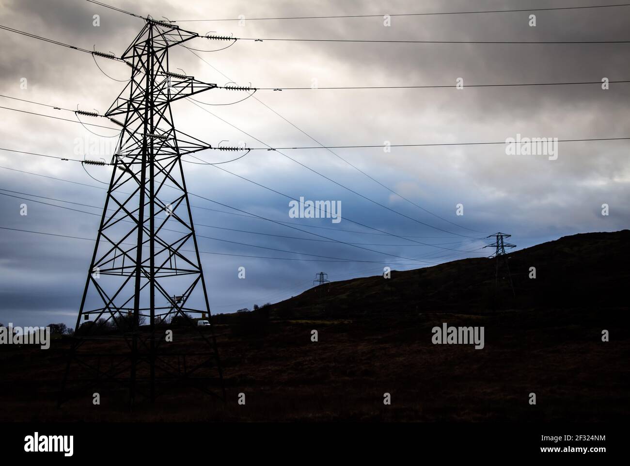 Electricity pylons in a field on a cloudy day in winter at Kendoon ...