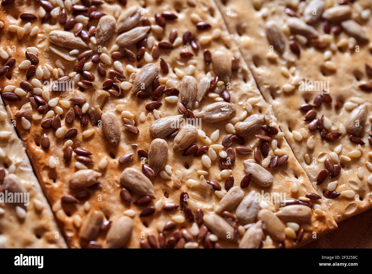 Flour breadcrumbs biscuits with sunflower flax seeds on awooden