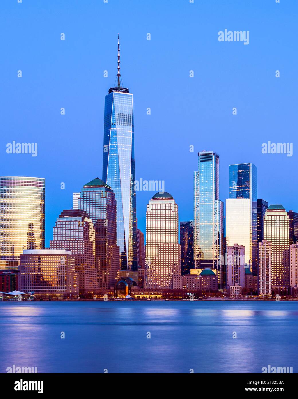 Freedom Tower at Dusk with Lower Manhattan Skyline and World Financial Center, Hudson River, New York City. Stock Photo