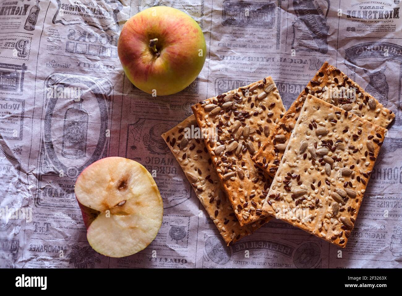 Flour breadcrumbs biscuits with sunflower flax seeds on a white paper background. Top view. High quality photo Stock Photo