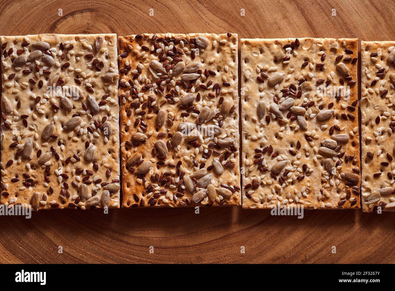 Flour breadcrumbs biscuits with sunflower flax seeds on awooden background. Top view. High quality photo Stock Photo