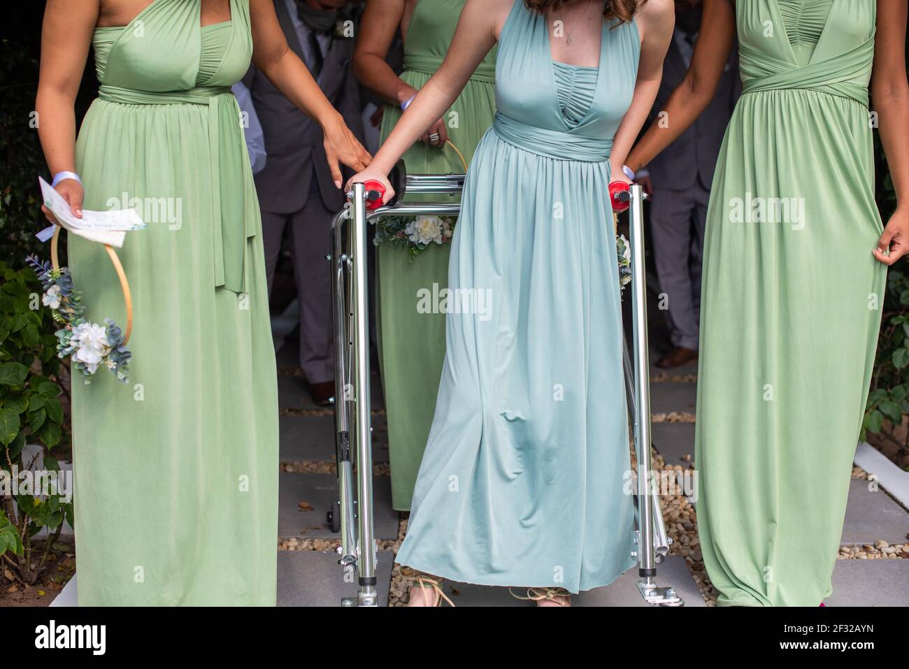 Bridesmaid walking in unison during event Stock Photo