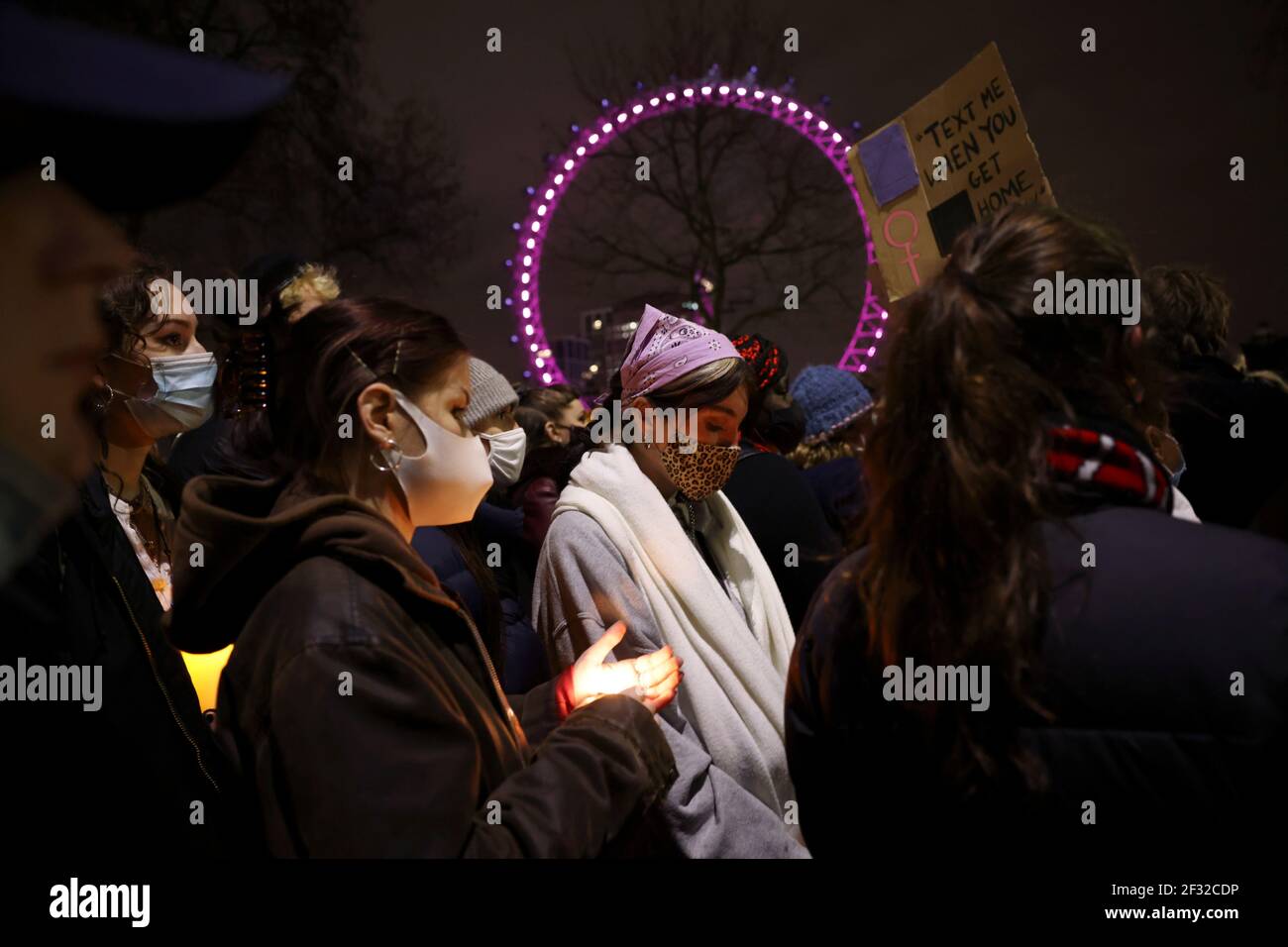 People attend a protest outside New Scotland Yard, following the kidnap and murder of Sarah Everard, in London, Britain March 14, 2021. REUTERS/Henry Nicholls Stock Photo