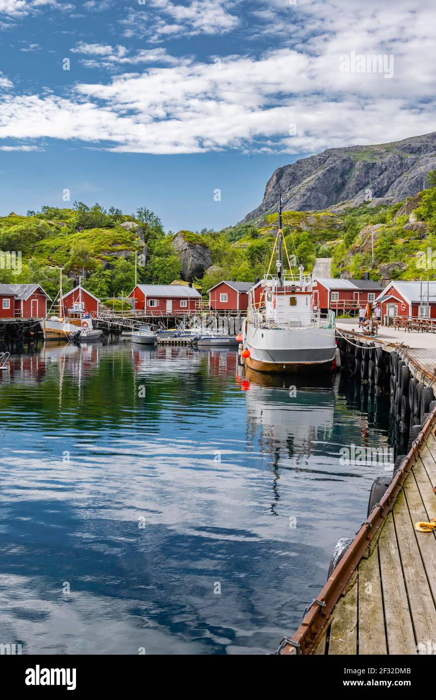 Harbour with fishing boat, Rorbu cabins, historic fishing village Nusfjord, Lofoten, Nordland, Norway Stock Photo