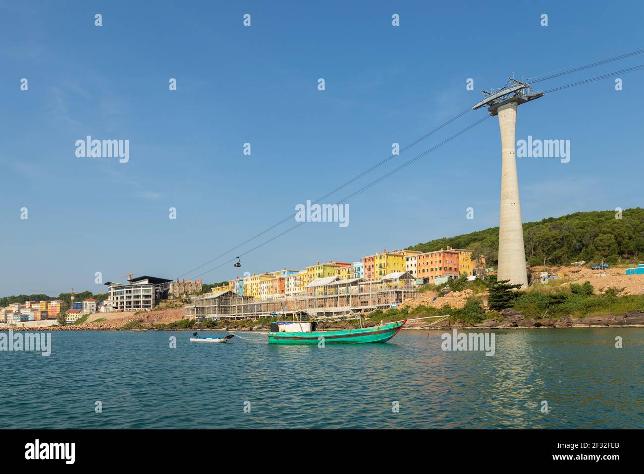 Fishing boat and cable car leaving the staion in the background, Phu