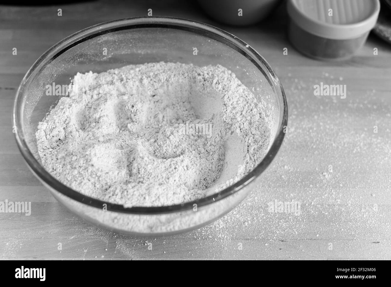 Raw ingredients of flour and yeast for making a loaf of bread at home Stock Photo