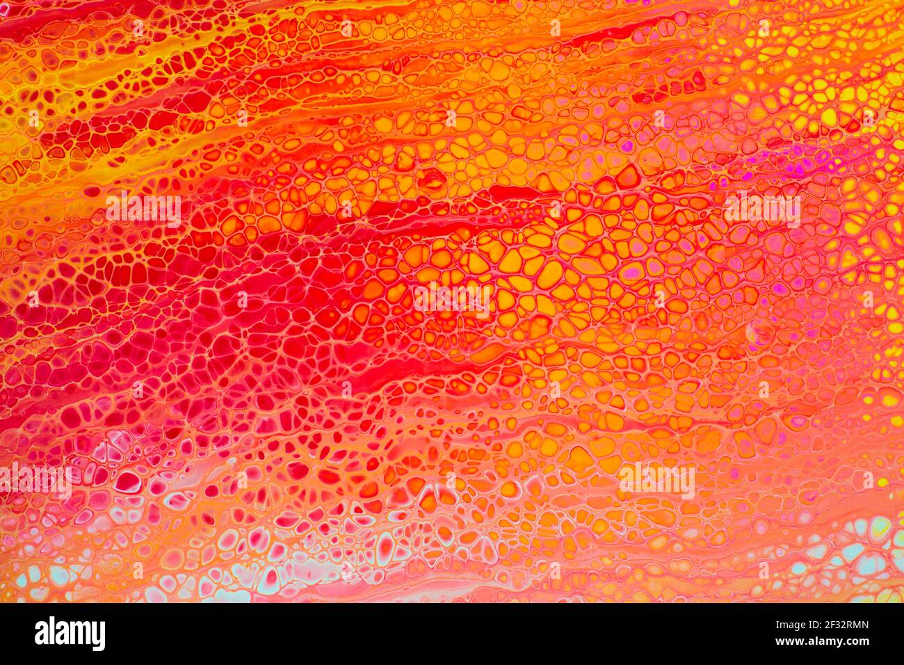 Colorful abstract acrylic painting in red, yellow and white. Free flowing cells. Pouring. Stock Photo