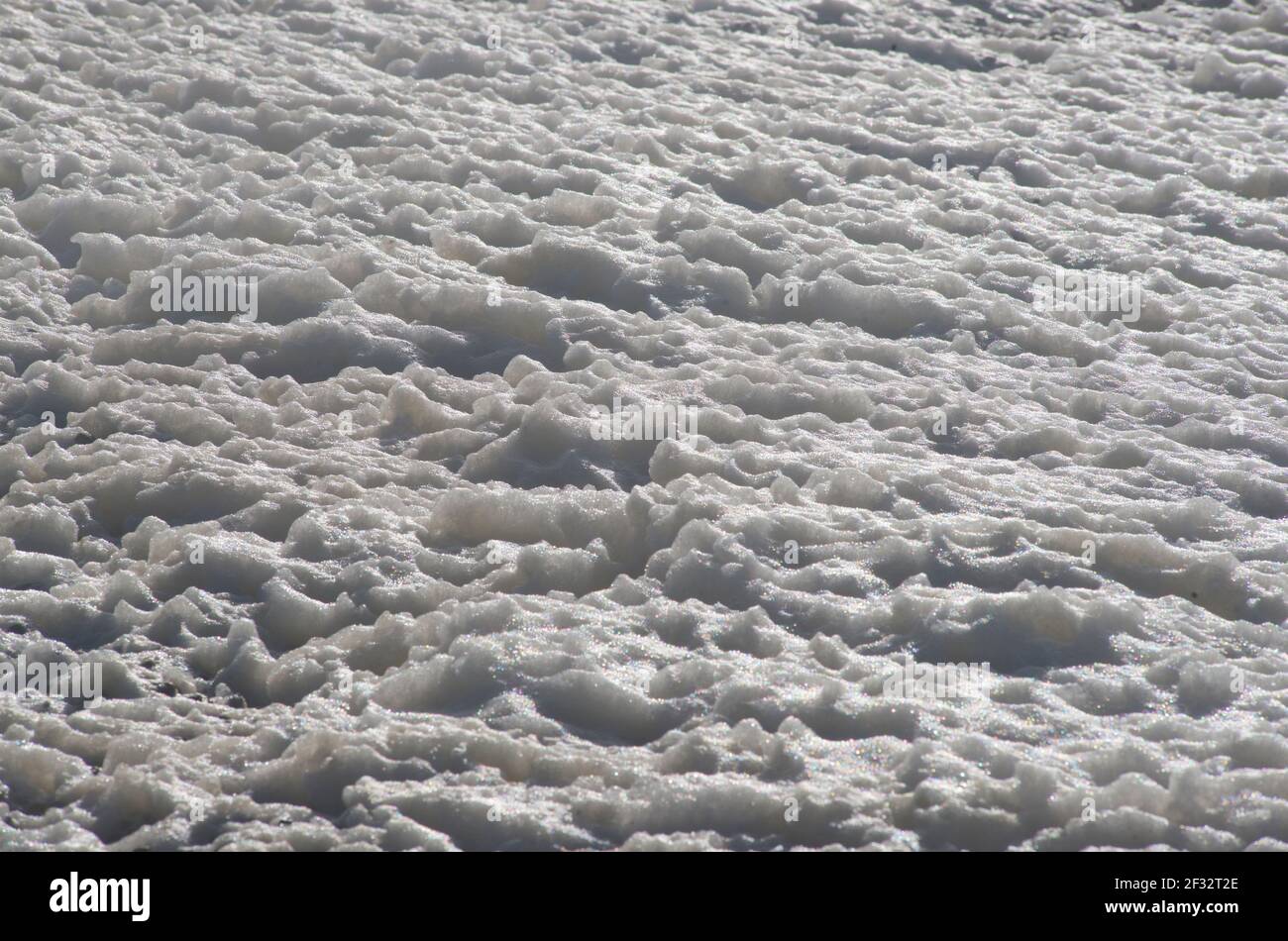 Foam. Sea froth on a stormy day on Brighton beach. East Sussex, England, UK. Stock Photo