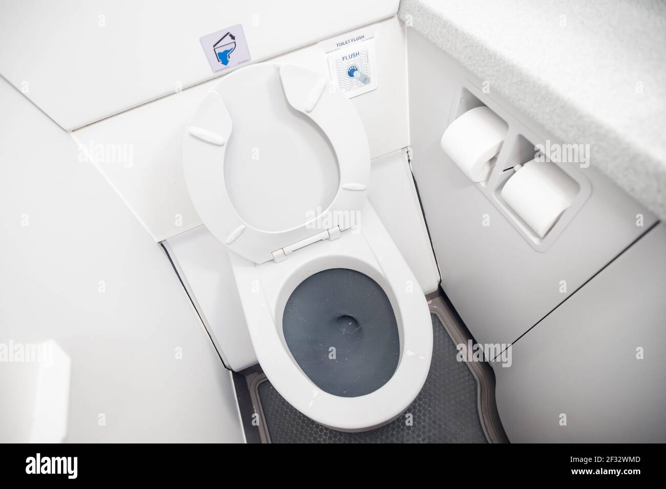 Airplane passenger lavatory toilet seat and water wash basin Stock Photo Alamy