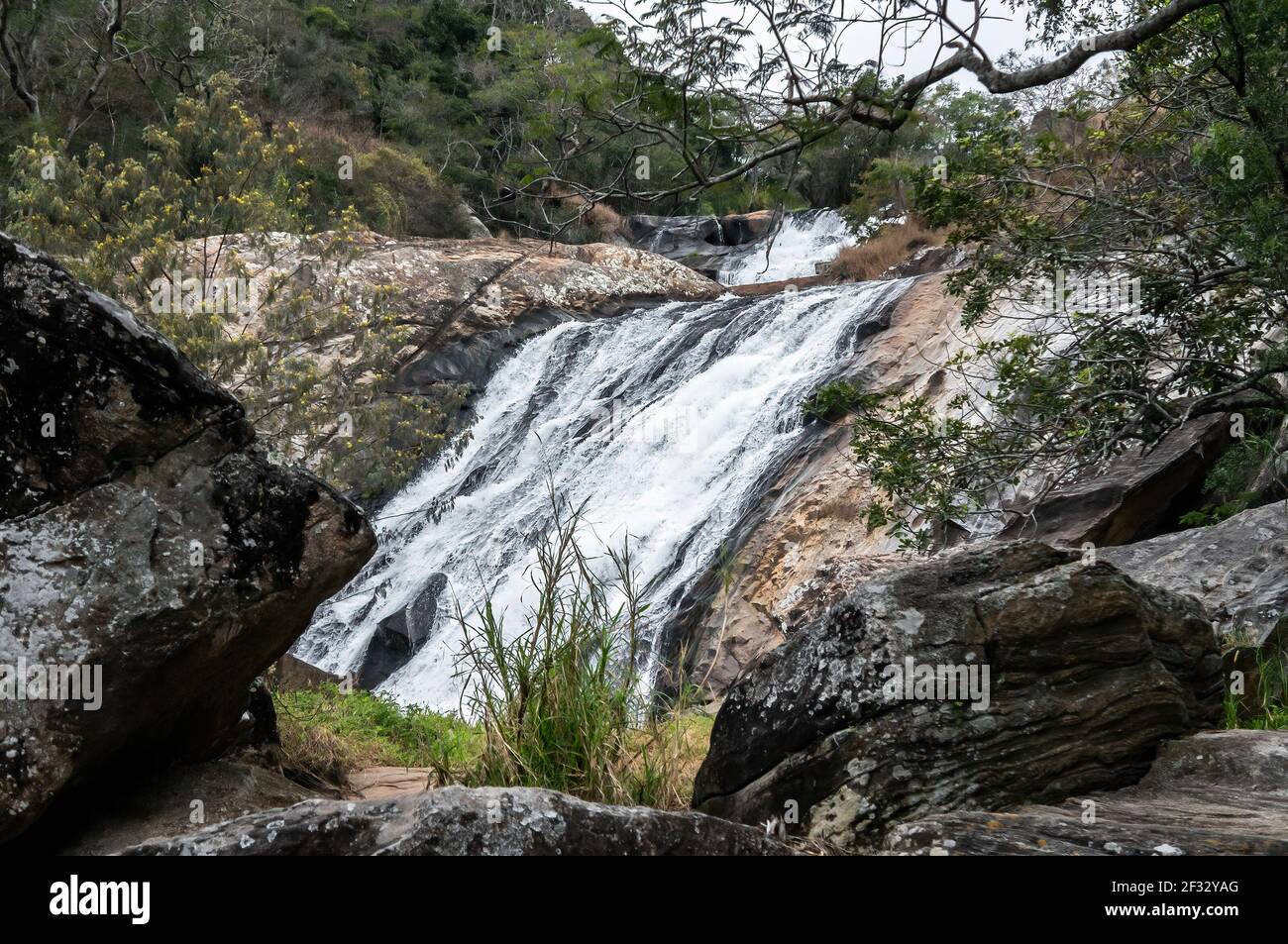 Foaming waters from Pimenta waterfall dripping over rock formations of Sea Ridge (Serra do Mar region) forest, Cunha countryside. Stock Photo