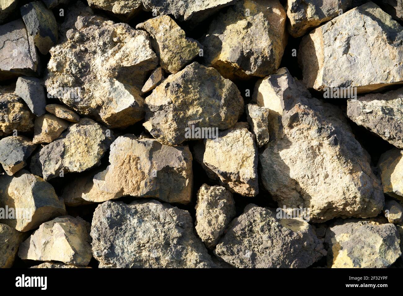Beige natural stones wall as background Stock Photo