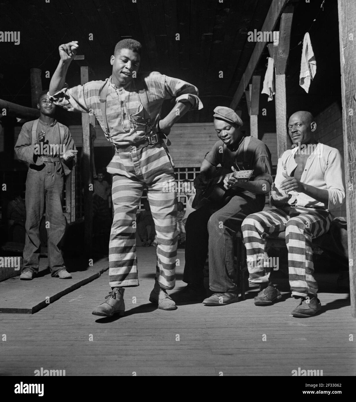 Convicts playing music and dancing, Greene County, Georgia, USA, Jack Delano, U.S. Farm Security Administration, May 1941 Stock Photo