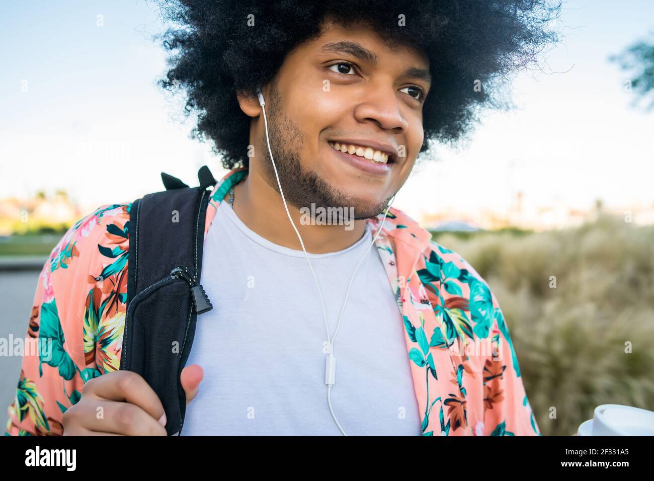 Latin man walking outdoors Stock Photo Alamy