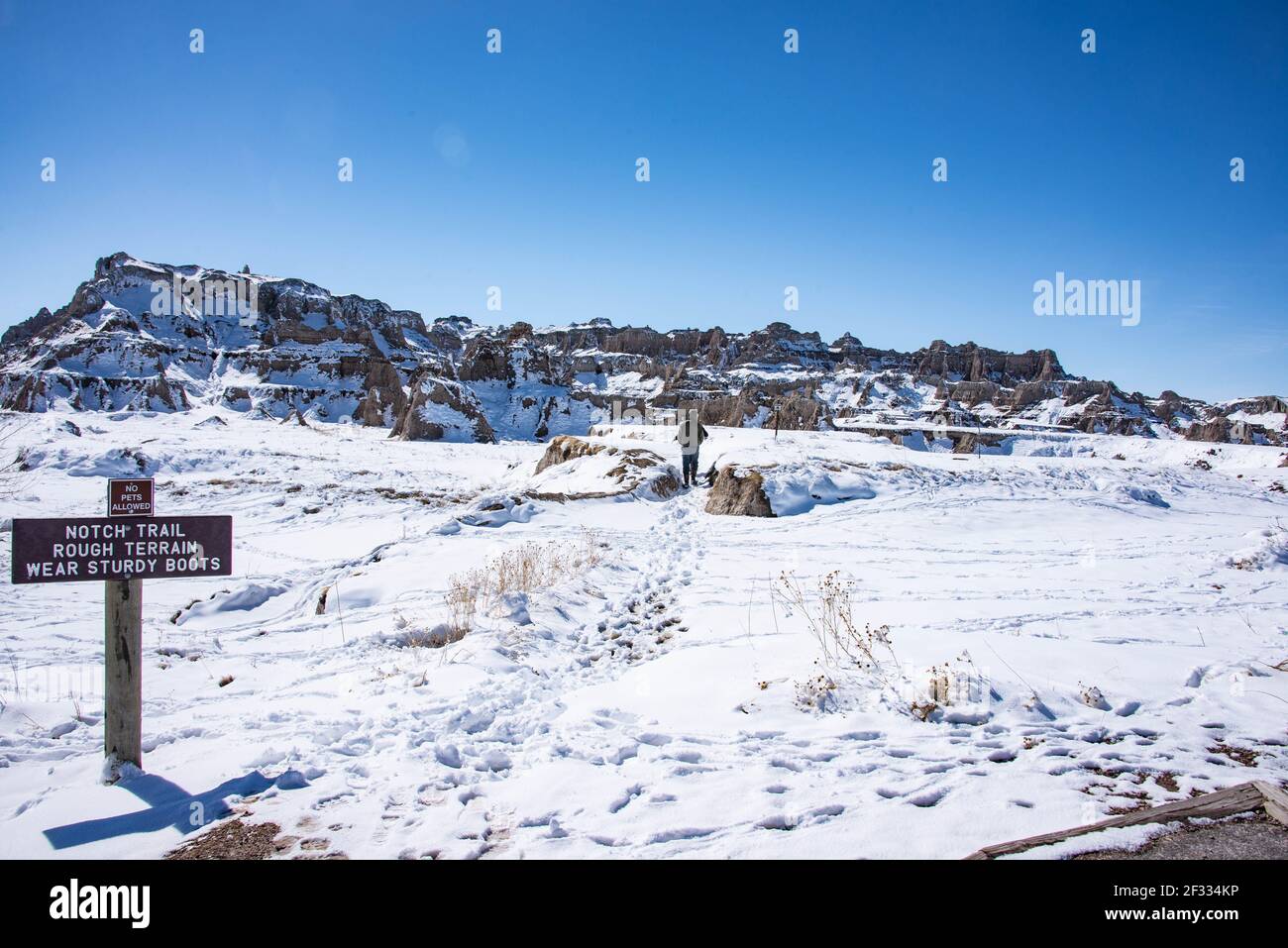 Trekking in Badlands National Park in winter, South Dakota, U. S. A