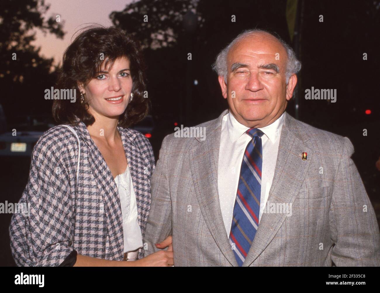 LOS ANGELES, CA - AUGUST 26: Actor Ed Asner and Gwen Seliger attend fundraiser for Michael Dukakis on August 26, 1987 at Sally Field's home in Los Angeles, California. Credit: Ralph Dominguez/MediaPunch Stock Photo