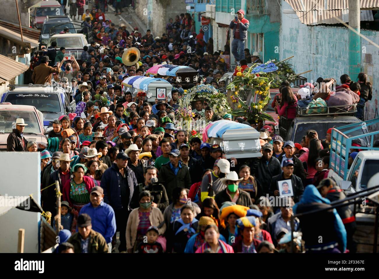 People carry coffins with the bodies of Rivaldo Jimenez Ramirez, Santa  Cristina Garcia and Ivan Gudiel Pablo, migrants killed in the Mexican state  of Tamaulipas while trying to reach the U.S., during