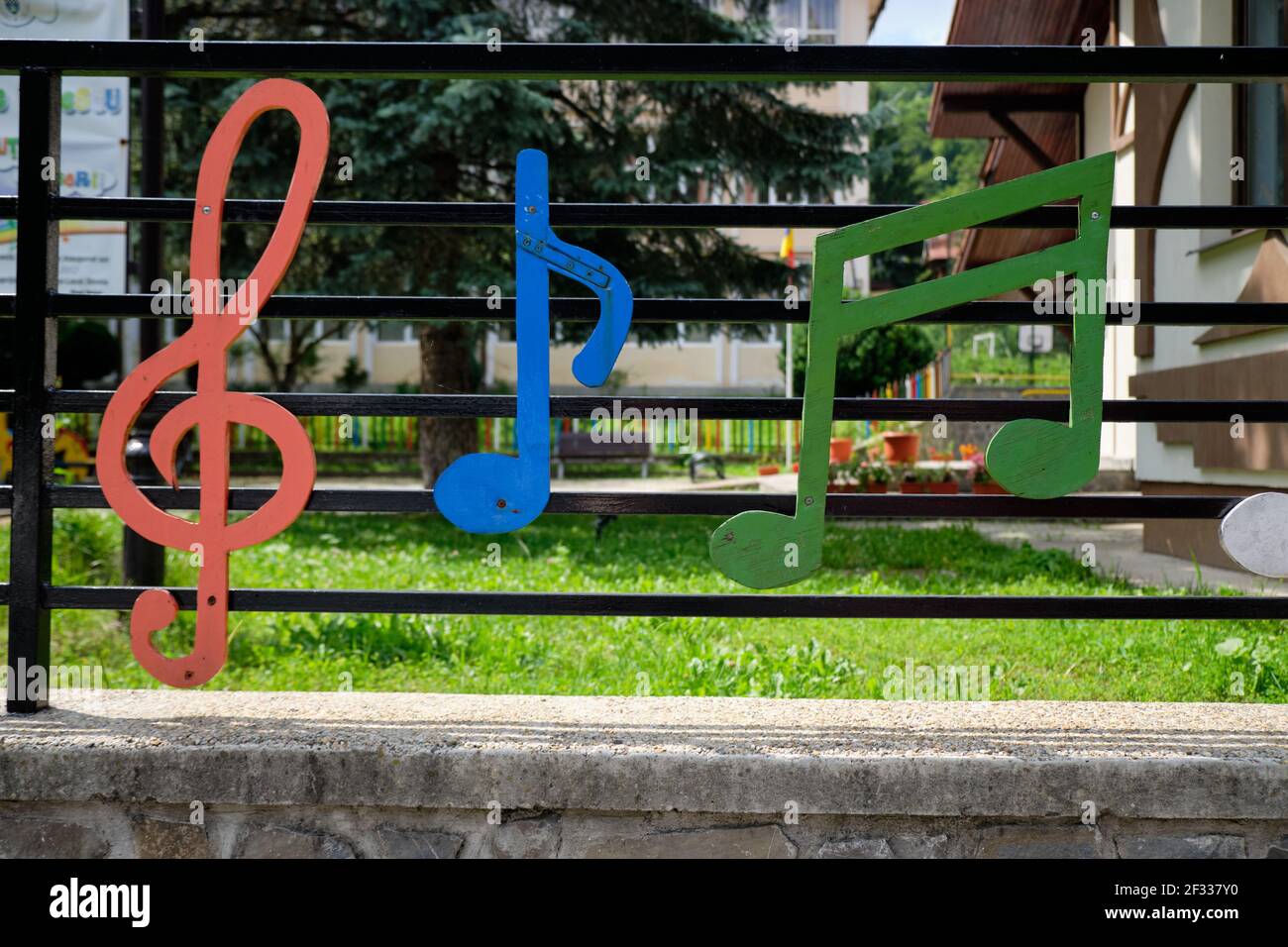 Metal fence with musical notes design Stock Photo - Alamy