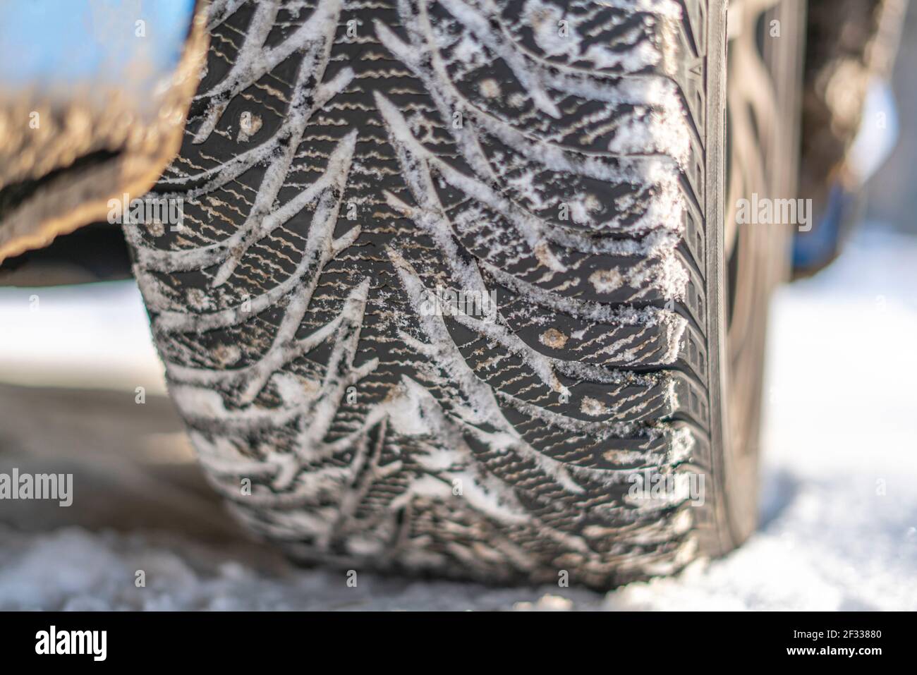 snow and ice winter car tyres. close up auto vehicle wheel Stock Photo