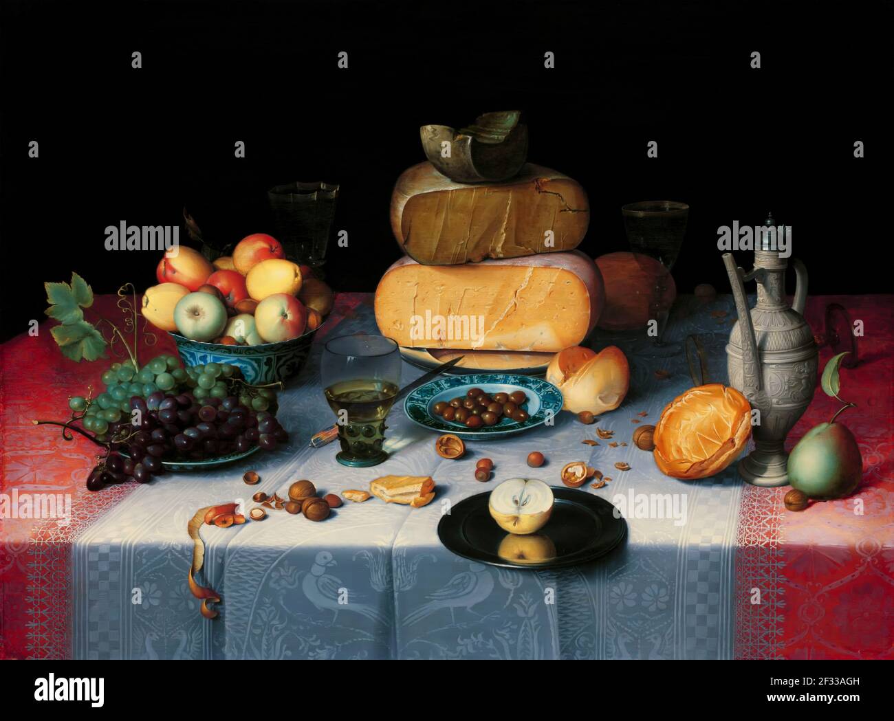 Fruit, bread, and cheese – grouped by type – are set on a table covered with costly damask tablecloths. The illusion of reality is astounding; the pew Stock Photo