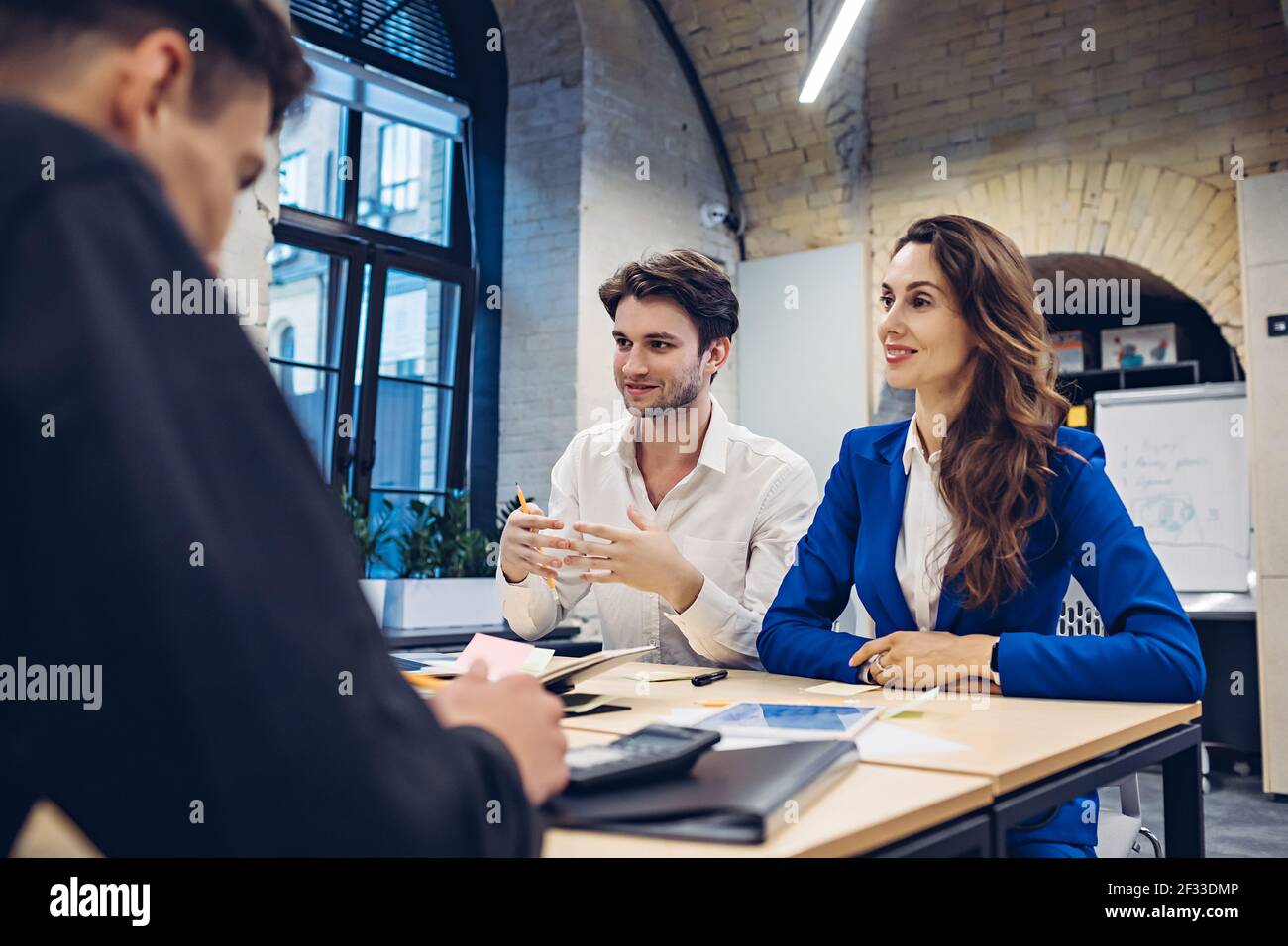 businesspeople discussing at table in office Stock Photo