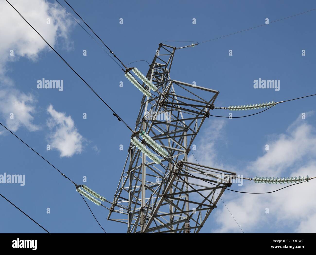 Electricity pylons and line against the blue sky and clouds Stock Photo ...