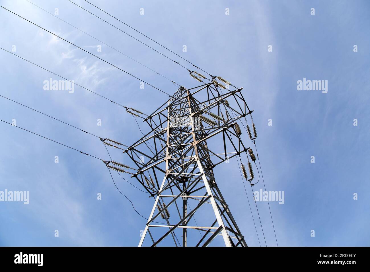 Electricity pylons and line against the blue sky and clouds Stock Photo ...