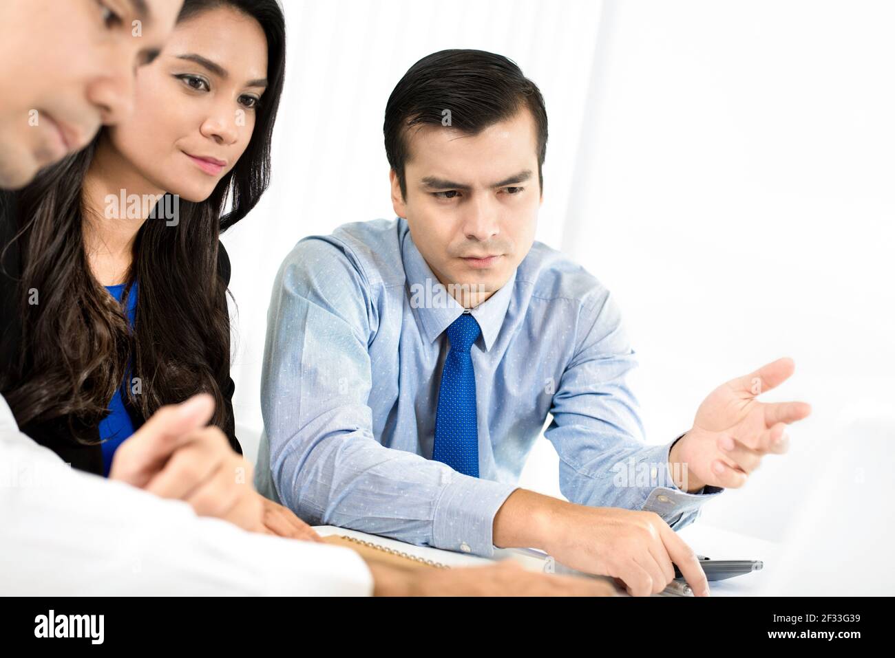 Business people discussing work in meeting room - business consulting and brainstorming concepts Stock Photo