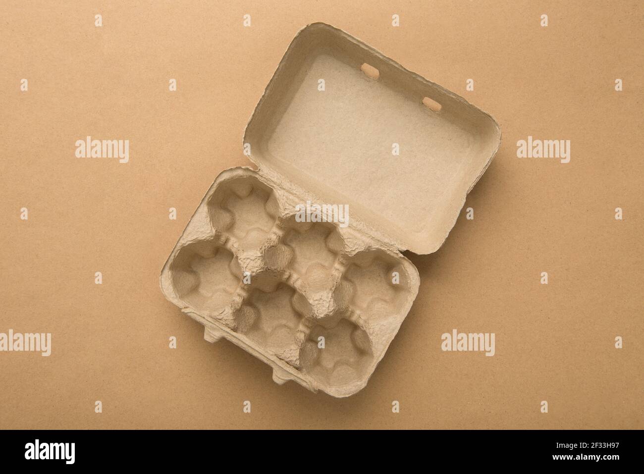 Empty brown paper pulp egg tray Stock Photo