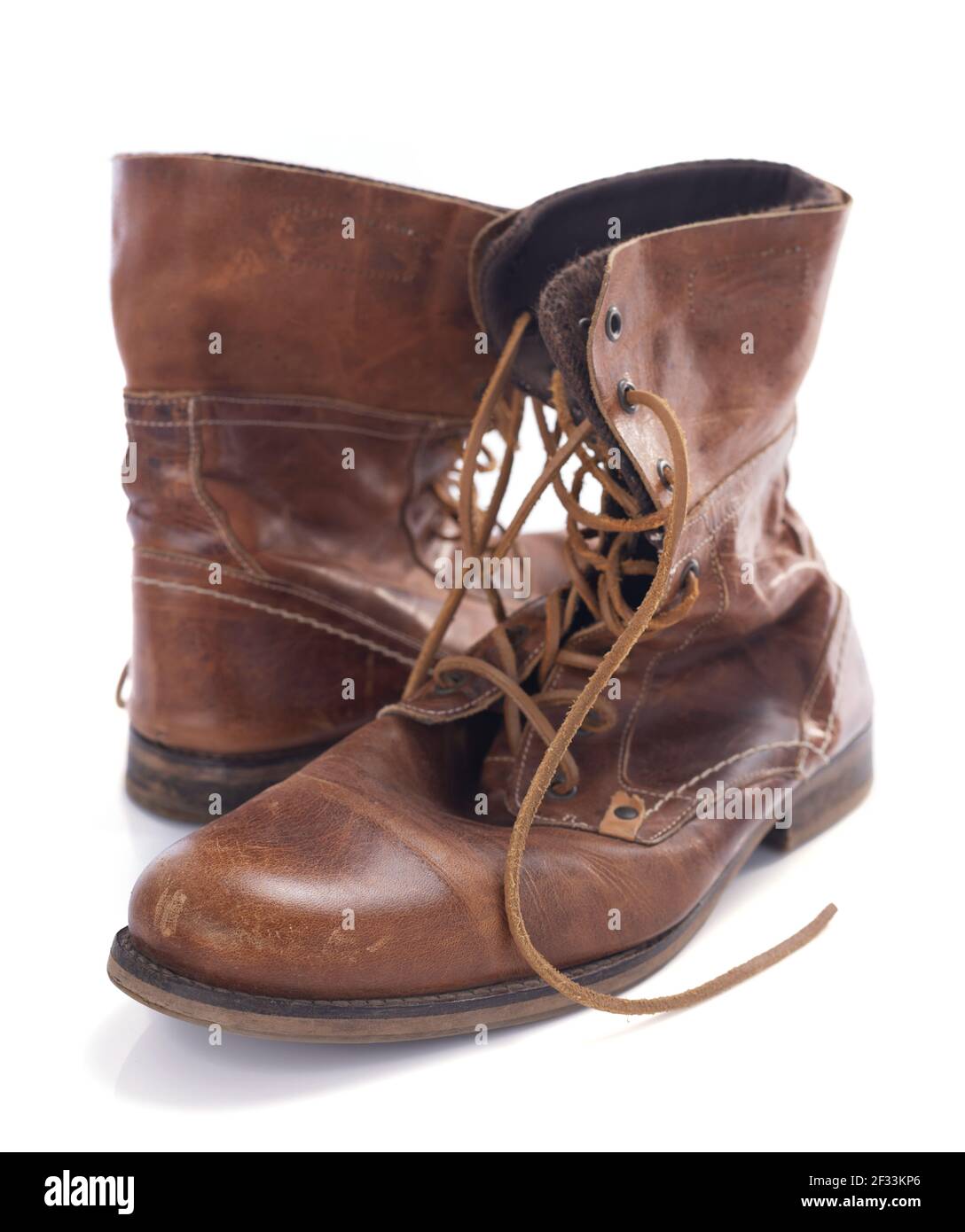 old leather travel vintage boots shoes isolated on white background Stock Photo