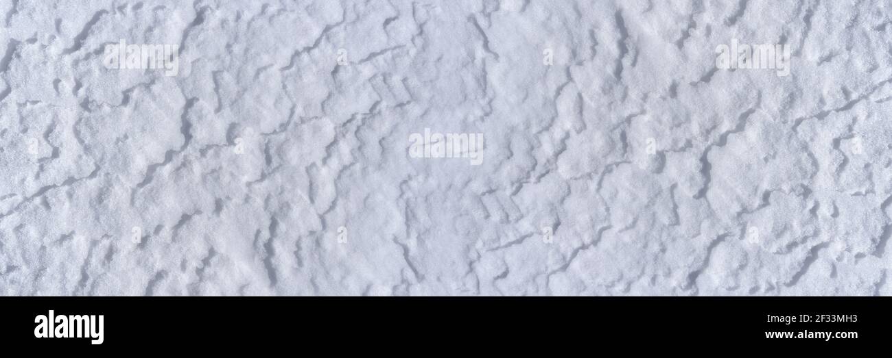 Panoramic snow surface with light drifts in closeup Stock Photo