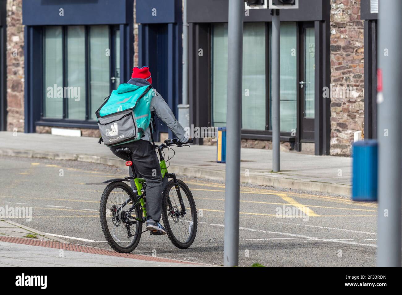 Deliveroo rider in Cork city centre, Ireland. Stock Photo